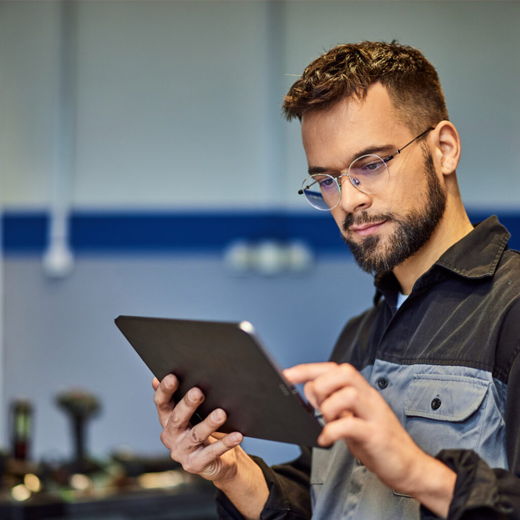 Man holding Ipad in dealership service department