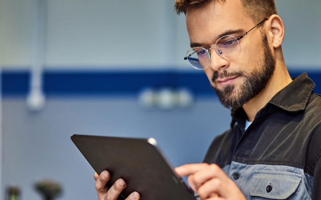 Man holding Ipad in dealership service department